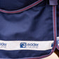 Navy blue equestrian blanket with Leader Equine logo on a white band.