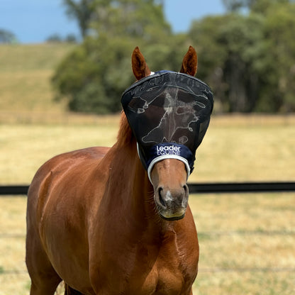 A brown horse wearing a black Leader Equine fly mask with fine mesh and a fleece edge.