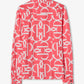 Pink long-sleeve shirt with white monogram pattern on a white background
